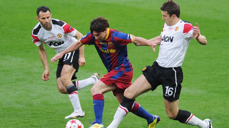 Lionel Messi takes on Ryan Giggs and Michael Carrick