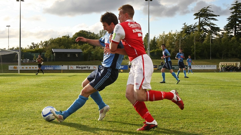 UCD's Sean Harding hold's off Daryl Kavanagh of St Patrick's