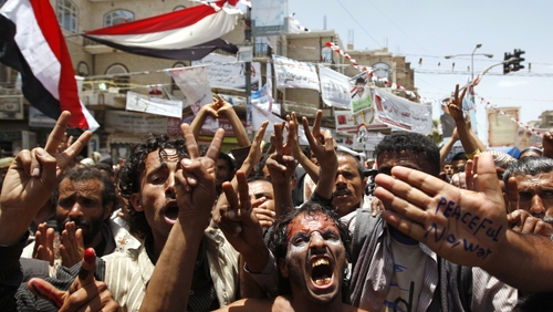 Sanaa - Anti-government protestors flash the V for 'victory' sign as they shout slogans during a demonstration