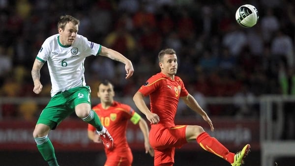 Glenn Whelan rises high to head clear for Ireland