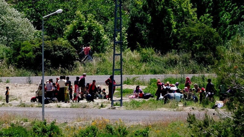Turkey - Syrian refugees wait to be transferred to a camp