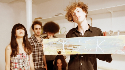 Blumberg (holding sign) and Yuck