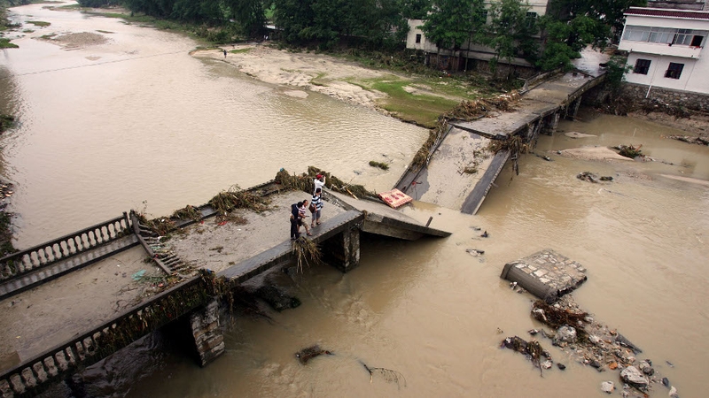 China - A bridge collapsed after a flood hit Tongcheng in Hebei province