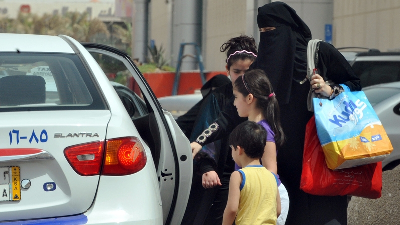 Saudi Arabia - Woman gets into a taxi