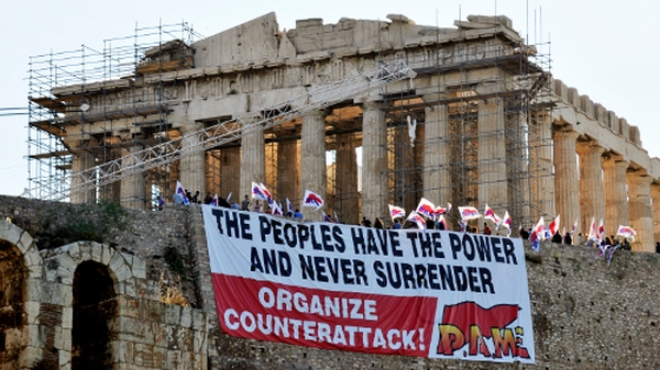 The EU and the IMF have warned Greece to tighten its austerity measures