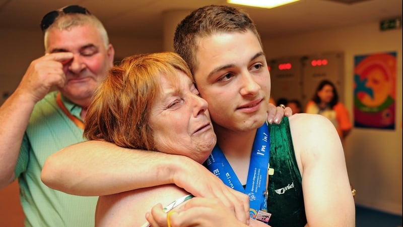 John Michael Gannon - Celebrates with his parents after winning a gold and silver medal in Athens