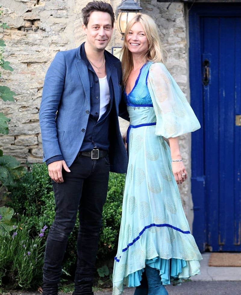 Moss wearing a 70s style hippy dress