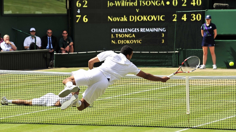 Jo-Wilfried Tsonga dives for a ball - The Frenchman and Novak Djokovic played a series of dramatic points