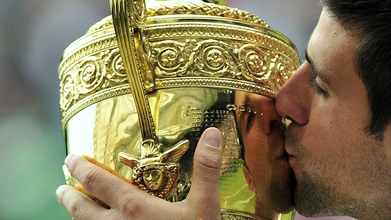 Novak Djokovic kisses the trophy - The Serb dominated the key points in the final