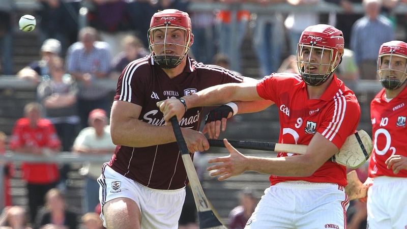 Iarla Tannion of Galway tussles with Cork's William Egan