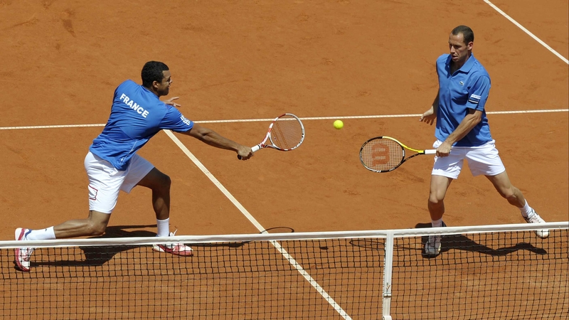 Michael Llodra (R) and Jo-Wilfried Tsonga - beat their German opponents in straight sets to help France advance to the semi-finals of the Davis Cup