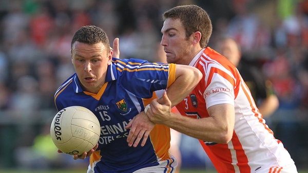 Leighton Glynn of Wicklow fends off Armagh's Brendan Donaghy