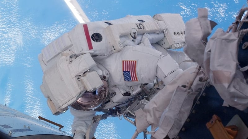 Mike Fossum does repairs on the International Space Station