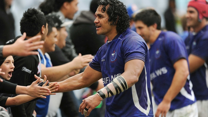 Shock winners - Samoan players celebrate with their fans after a 32-23 victory over Australia