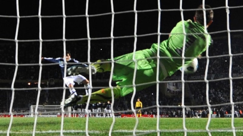 Going out - Carlos Tevez's penalty is saved by Uruguayan goalkeeper Fernando Muslera
