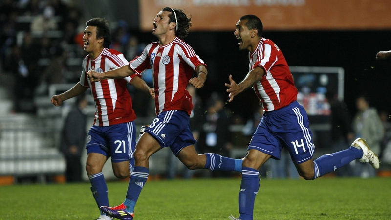 Paraguayan players Marcelo Estigarribia, Nelson Haedo and Paulo da Silva celebrate their victory over Brazil