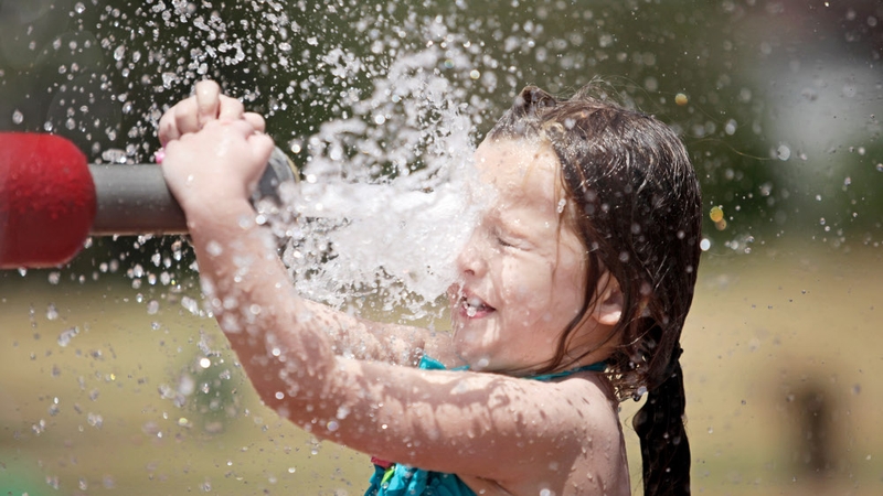Heatwave - A girl cools off in Oklahoma as a heatwave hits the US midwest