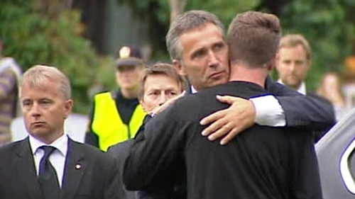 Jens Stoltenberg comforts Eskil Pedersen, the leader of the Norwegian Labour Youth league