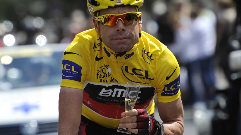 Cadel Evans - Rides with a glass of Champagne in the 95km and last stage of the 2011 Tour de France