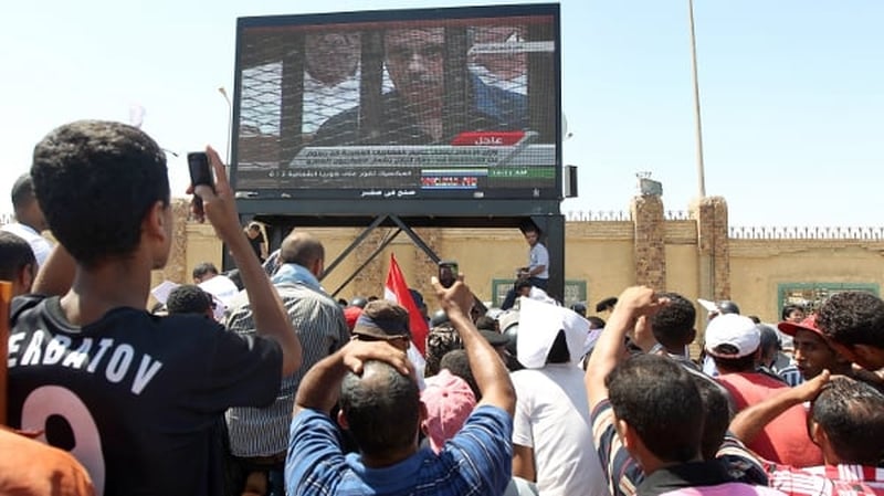 Cairo - Thousands gather outside to watch the trial on big screens
