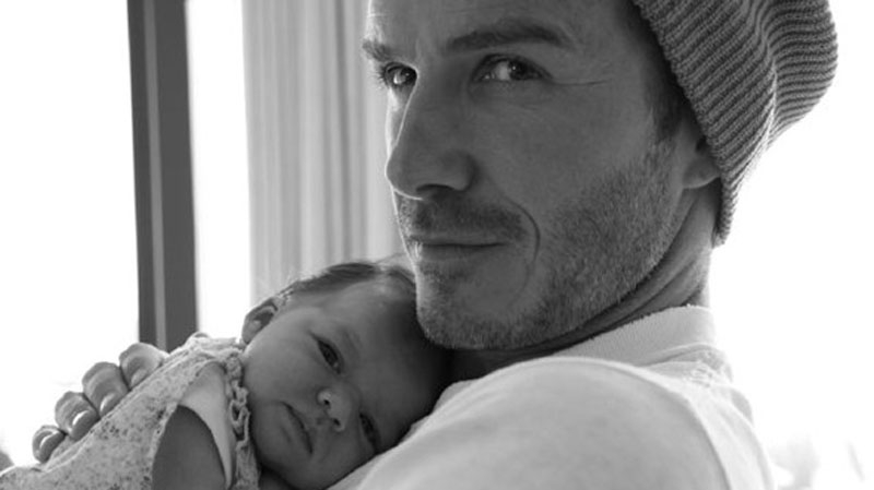 David shares a tender moment with baby Harper