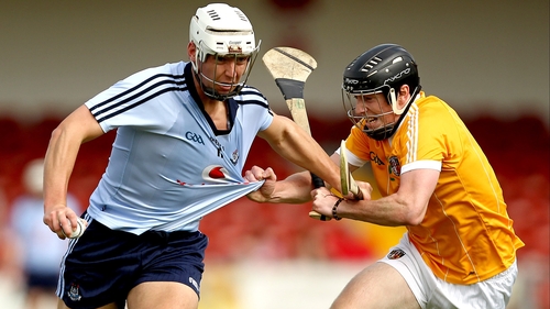 Dublin's Mark Schutte -Holds off Michael Armstong of Armagh
