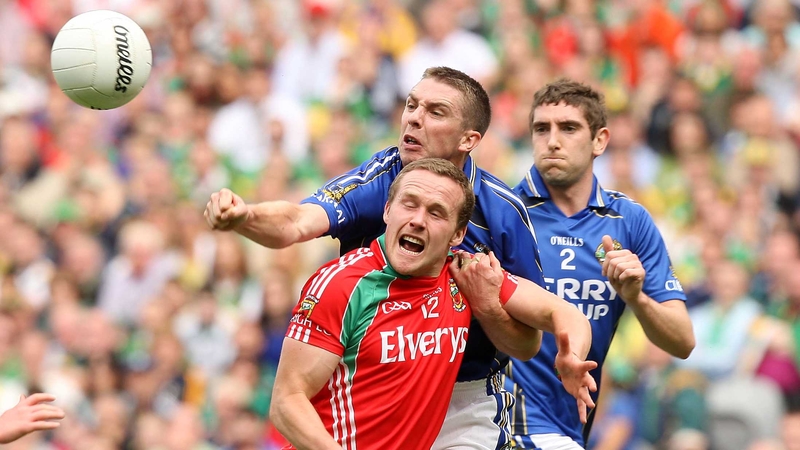 Mayo's Andy Moran (red) and Marc O'Se (blue) of Kerry