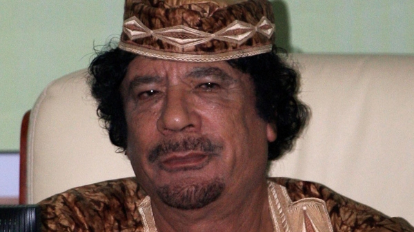 Interpol has issued an arrest warrant for Gaddafi