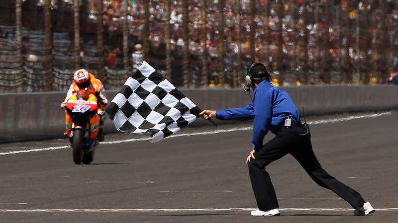 Stoner - Crosses the finishing line in Indianapolis
