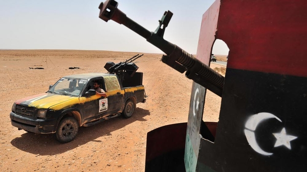 Rebels surrounding two towns loyal to Col Gaddafi