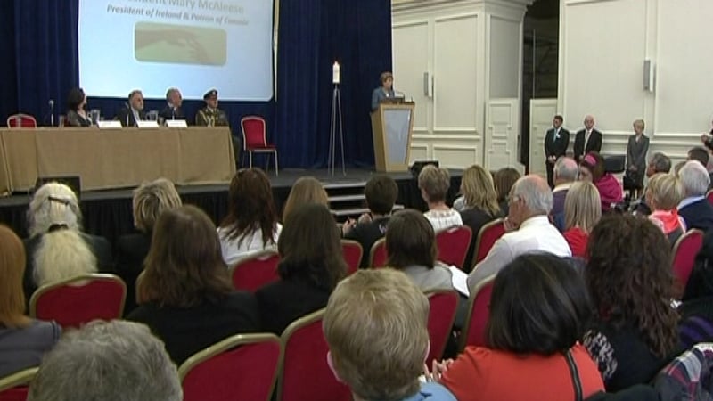 President McAleese lit a candle for those affected by suicide