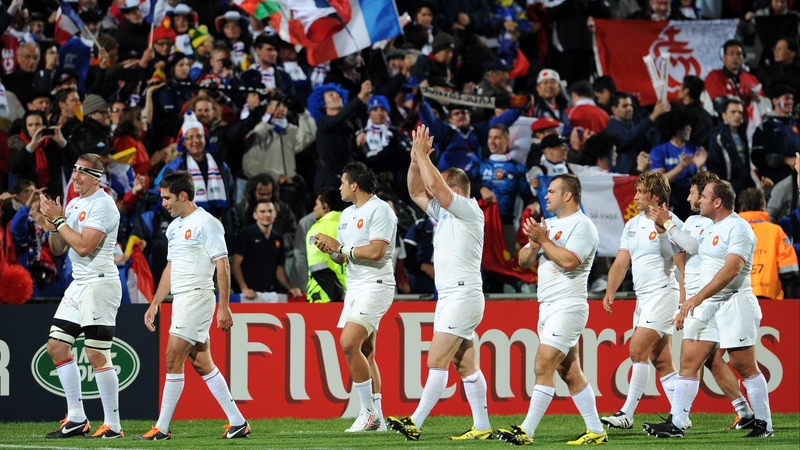 Some French players applaud as they leave the field after their 47-21 victory over Japan