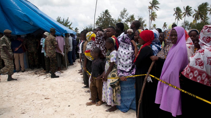 Relatives queue to identify the bodies of victims