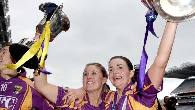 Ursula Jacob lifts the Senior trophy as Colleen Atkinson lifts the Intermediate trophy for the Model County
