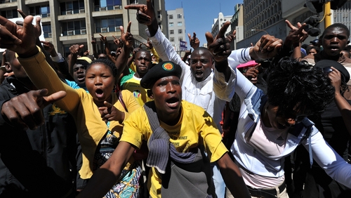 Supporters of Malema protest outside the court in Johannesburg
