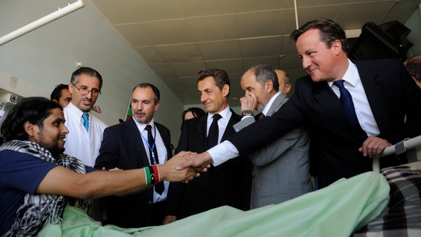 Nicolas Sarkozy and David Cameron meet patients at a medical centre