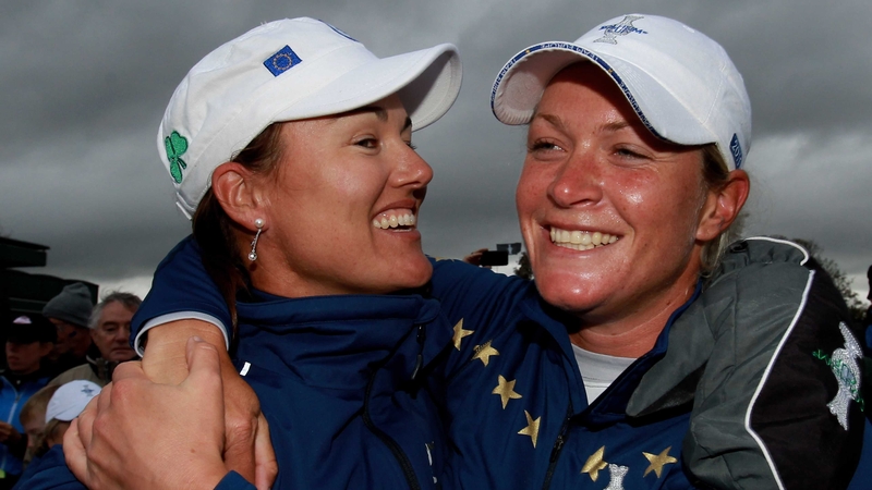 Sophie Gustafson and Suzann Pettersen of Europe celebrate their team's victory on the 18th green