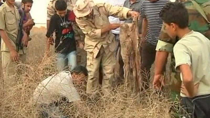 Mass grave linked to Muammar Gaddafi