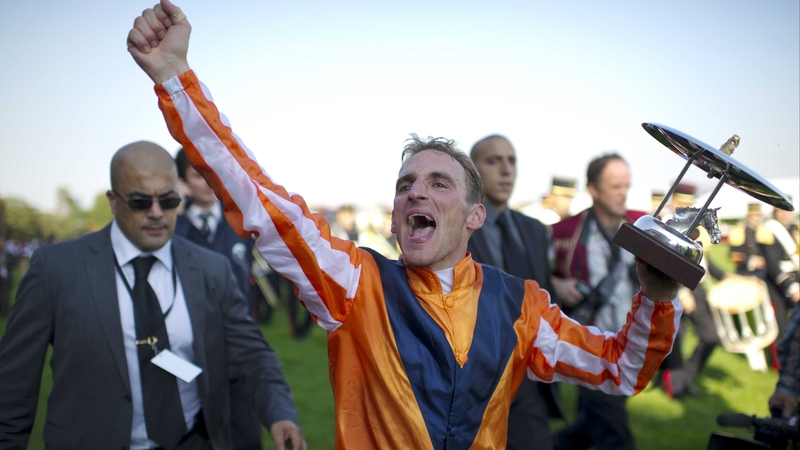 Andrasch Starke celebrates riding Danedream to victory in the Arc