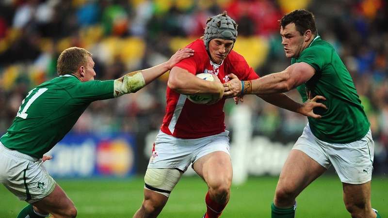 Wales 22-10 Ireland: Jonathan Davies charges between Keith Earls and Cian Healy