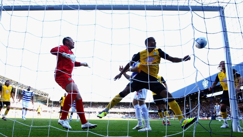 Paul Robinson and Martin Olsson watch Heidar Helguson's shot go in