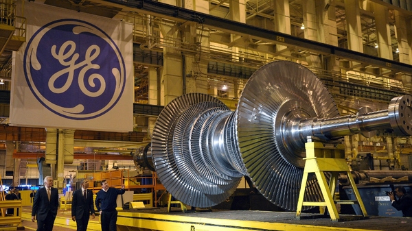 General Electric boosted by sales of plane engines and NBC