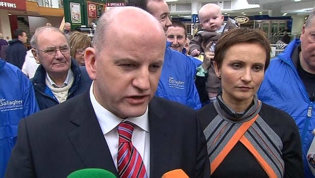 Independent candidate Seán Gallagher speaks to the media during the 2011 Presidential election and is surrounded by supports