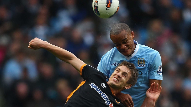City v Wolves - Ireland striker Kevin Doyle contests the ball with Vincent Kompany who was later sent off