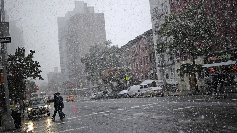 Snow falls on New York City
