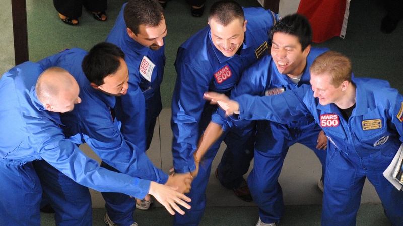 The crew of one Chinese, one Italian, one Frenchman and three Russians were met by family and friends