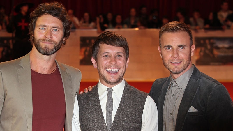 Mark Owen with band mate Howard Donald and Gary Barlow