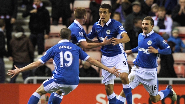 Franco Di Santo (second from right) is mobbed after scoring the winner for Wigan