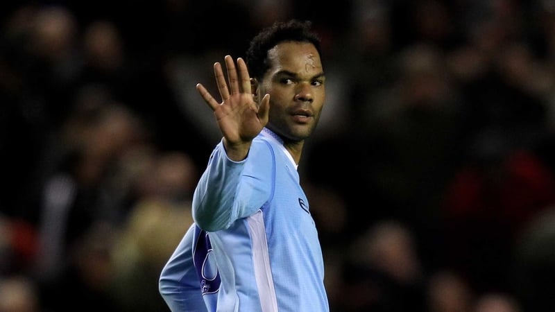 Sorry - Joleon Lescott gestures an apology to City keeper Joe Hart after deflecting the ball into his own net