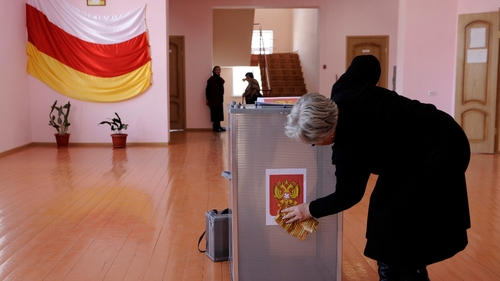 A member of a local election commission prepares a polling station in Tskhinvali